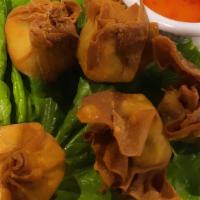 Fried Wontons · Six fried wonton filled with shrimp and pork served with sweet and sour sauce.