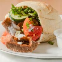 Gyros Sandwich · Seasoned beef lamb charbroiled on a vertical rotisserie, thinly sliced and served pita bread...