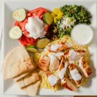 Marinated Chicken Platter · Marinated chicken sliced and served atop rice pilaf and your choice of salad: lettuce, tabbo...
