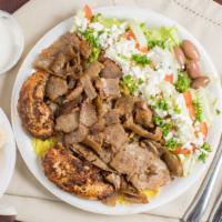 Combo Platter · Seasoned beef lamb and marinated chicken served atop rice pilaf and your choice of salad: le...