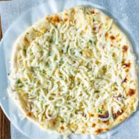 Garlic Cheese Naan · Clay oven baked bread with fresh garlic and mozzarella cheese.