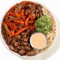 Chimi Steak Bowl · seared beef tenderloin, herb brown rice, roasted red peppers, onions and mushroom mix, chipo...