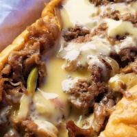 Cheese Steak And Grill Onion Sandwich · Cheese steak and fried onion.