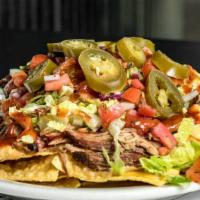 Aj'S Ultimate Nachos · Half order of crispy tortilla chips smothered with your choice of tender pulled pork, grille...