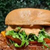 Smashville Burger · BeyondⓇ Smashburger with Vegan Cheeze, Onion Jam, House Sauce, Lettuce, and Sliced Tomato on...