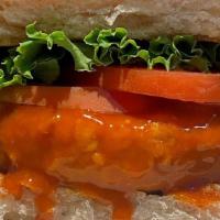Chick’N’Veg Sandwich · Gluten Free Vegan Chickpea Patty fried and served on a bun with lettuce, tomato and coleslaw...