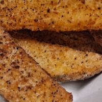 Gluten Free Vegan Potato Wedges · Cut and seasoned potatoes fried until crispy. Add cheese sauce for an additional charge.