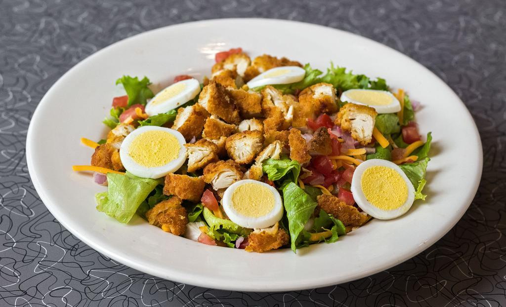 Ranch Chicken Tender Salad · Sliced fried chicken tenders, mixed greens, tomato, purple onions, hot Pepper Jack cheese, hard-boiled egg and ranch dressing.