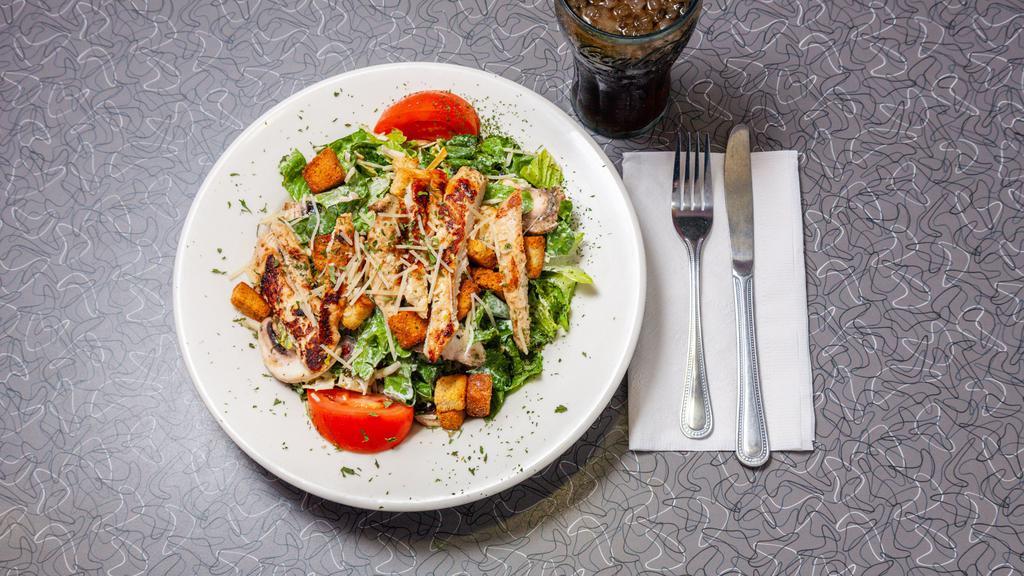 Grilled Chicken Caesar Salad · Romaine, Parmesan and Jack cheese, mushrooms, tomato, olive salad, croutons and our famous Caesar dressing.