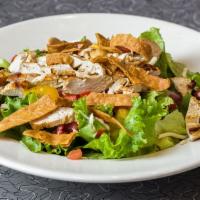Santa Fe Salad · A seasoned, grilled and sliced chicken breast on mixed greens with black beans, hot Pepper J...