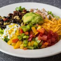 Cobb Salad · Turkey breast, bacon, cheddar cheese, tomato, olive salad, hard-boiled egg, peppers and avoc...