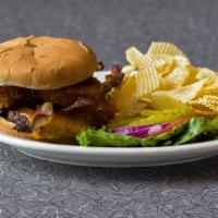 Rodeo Burger · Topped with crispy bacon, cheddar cheese, honey mustard BBQ sauce and onions rings.