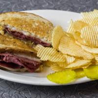 Grilled Corned Beef Rueben Sandwich · Traditional New York style - leaned corned beef, Swiss cheese and kraut on light rye bread, ...