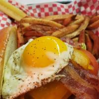 Gun Show Burger · Fresh ground beef seasoned and grilled, topped with bacon, cheddar, fried egg, lettuce, toma...