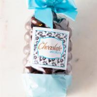 Dark Chocolate Coconut Almonds · Toasted almonds covered in coconut and dark chocolate. One of our customer favorites!