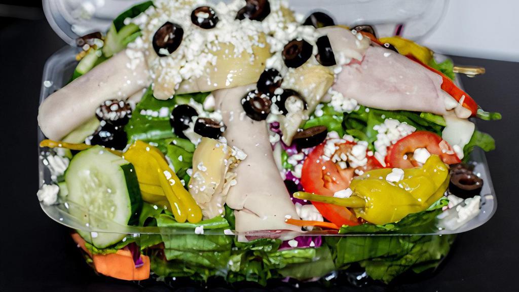Antipasto Salad · Bed of lettuce topped with pepperoni, salami, provolone cheese, artichokes, roasted red peppers, black olives & tomatoes, served with oil & vinegar.