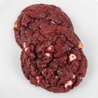 Red Velvet Deluxe Cookie · Soft and red velvet dough accented with chocolate chips.