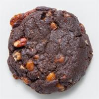 Chocolate Turtle Caramel Chunk · Rich chocolate dough loaded with toasted pecans and chunks of caramel.
