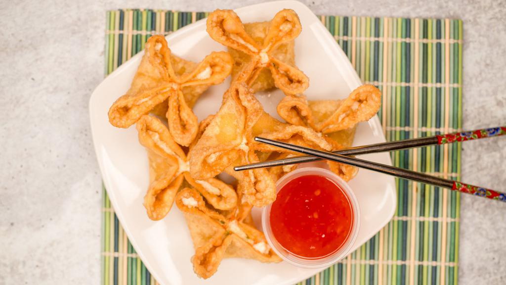 Crab Rangoon(6) · Hand folding wonton wrappers filled with crab meat& cream cheese, deep fried to golden brown, served with sweet chili sauce.