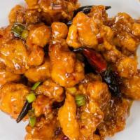*General Chicken · Crispy golden chicken chunks cooked in a spicy sweet brown sauce.