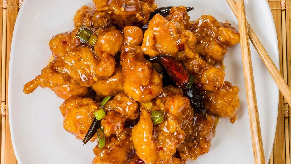*General Chicken · Crispy golden chicken chunks cooked in a spicy sweet brown sauce.