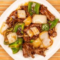 Pepper Steak · Tender beef with green peppers, onions  cooked with a light brown sauce.