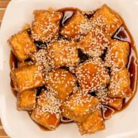 Sesame Tofu · Tender fresh tofu cubes fried to golden brown, cook with a sweet sesame sauce.