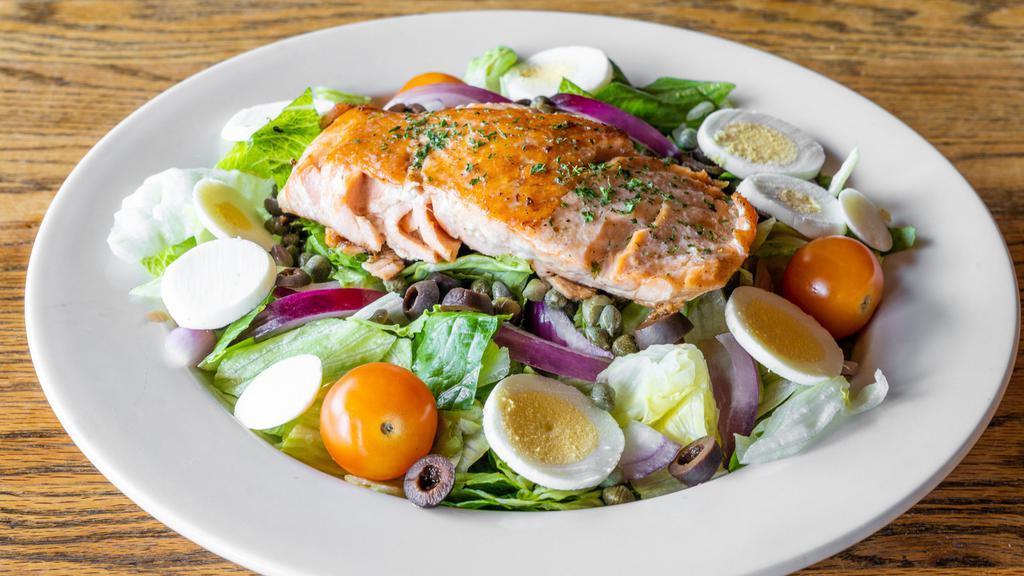Salmon Salad · Fresh salmon on top of fresh greens with capers, red onions, black olives, and sliced boiled egg with balsamic vinaigrette.