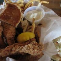 Catfish Basket · Smaller portion with fries slaw cajun cornbread and our homemade tartar sauce.