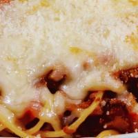 Baked Spaghetti Parmesan · Spaghetti topped with a blend of cheeses, baked and served with parmesan, and tossed with ga...