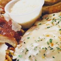 Chicken Parmesan · Sauteed chicken breast on marinara, topped with cheese and baked, served with a side of spag...