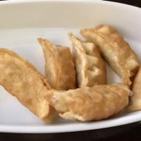 Potstickers (8 Pc) · Chicken and vegetables filled with dumplings (steamed or deep-fried).