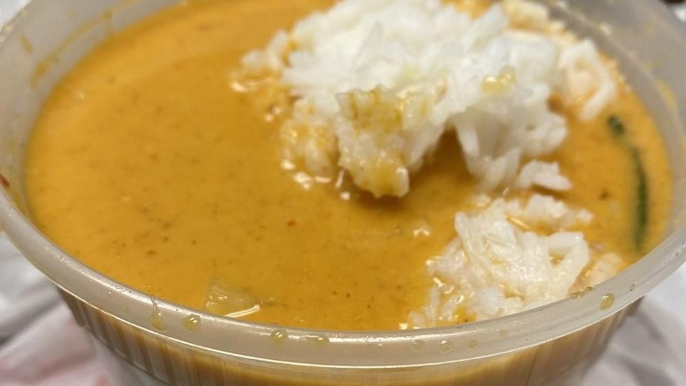 Red Curry · Coconut milk, spicy curry paste, bamboo shoots, bell pepper, and basil. Choice of meat: chicken, pork, beef, or tofu, Add shrimp for an additional charge.