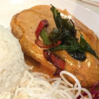 Spicy Fish · Deep-fried tilapia smothered in a thick Panang curry sauce topped with fried bell pepper and...