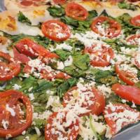Roma Spinach Pizza · Served with spinach, tomato,garlic, mozzarella and feta.