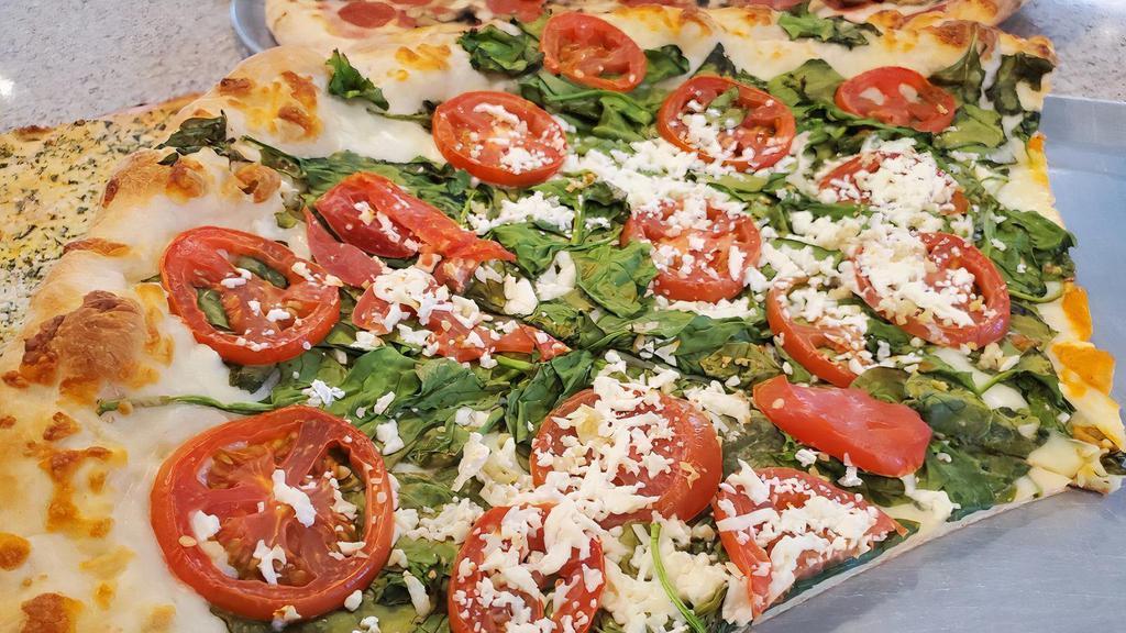 Roma Spinach Pizza · Served with spinach, tomato,garlic, mozzarella and feta.