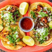 Street Tacos · One of each filled with chicken, carnitas, steak and chorizo tacos with onions, cilantro and...