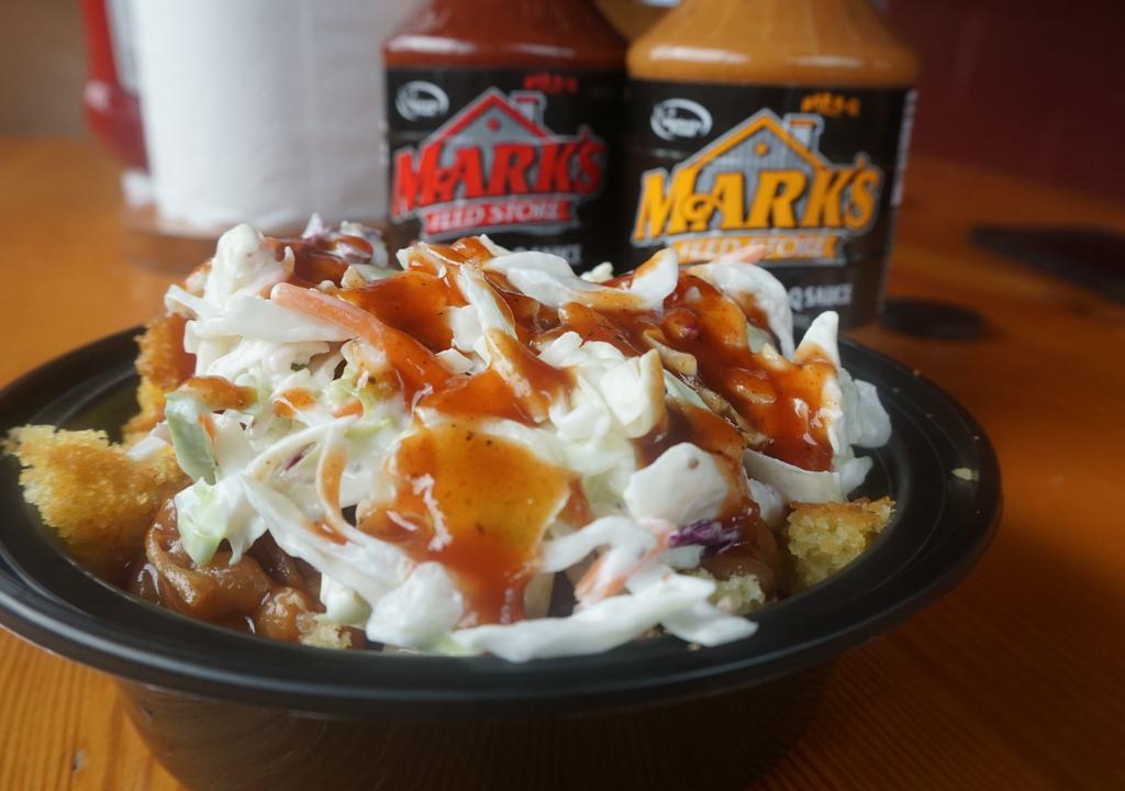 Q-Bowl · Everything you love about great Bar-B-Q in a bowl!  Enjoy two corn muffins topped with 3 oz of pulled pork smothered in Mark’s Original Bar-B-Q Sauce, Baked Beans, Cole Slaw and a final swirl of sauce to finish it off.