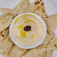 Hummus · Chick peas whipped with tahini sauce, lemon, fresh garlic, olive oil and pita bread.