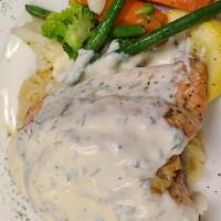 Stuffed Salmon W/Crab · Stuffed with lump crab meat, served over angel hair pasta topped with cream dill sauce also ...