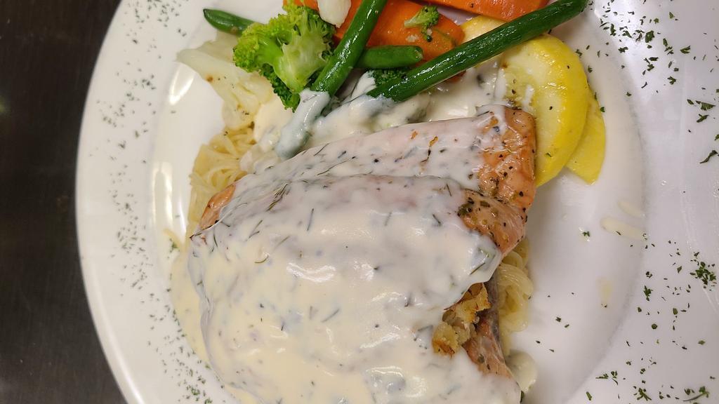 Stuffed Salmon W/Crab · Stuffed with lump crab meat, served over angel hair pasta topped with cream dill sauce also includes house vegetable