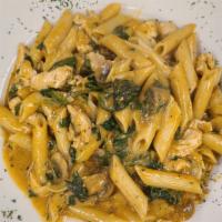 Tuscan Chicken · With penne, creamy tomato sauce, spinach, mushrooms, and artichokes.