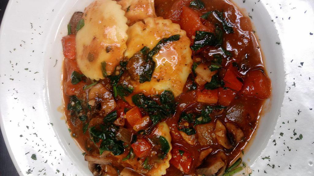 Cheese Ravioli (4) · With mushrooms with white wine tomato sauce and basil and spinach.