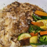 Veal Marsala · Medallions over mashed potatoes, topped with mushroom marsala sauce with house vegetable.