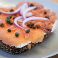 Salmon Lox Toast · Cream cheese, cured + smoked salmon, red onion, and capers on thick sliced deli rye.