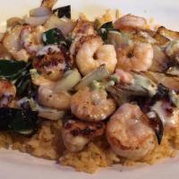 Arroz Con Camaron · Tender shrimp grilled with mushrooms, onions, and poblano pepper, served on a bed of rice an...