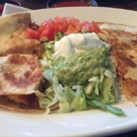Fajita Quesadilla · Our big size flour tortilla stuffed with grilled beef or chicken and melted cheese served wi...