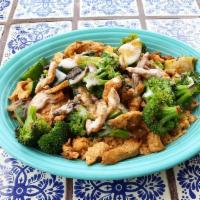 Veggie Feliz · Juicy grilled chicken with a mix of grilled broccoli, zucchini, and mushrooms all served on ...