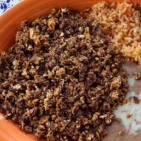 Lunch Huevos Con Chorizo · A scramble of chorizo and eggs served with a side of fresh rice, homemade refried beans, and...
