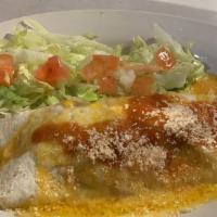 Seafood Enchilada · Seasoned chicken, beef, or beans wrapped in a flour tortilla, topped with melted Cheddar che...